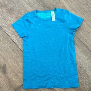 Ivivva girls top. Size 6. Color torques with green flex.